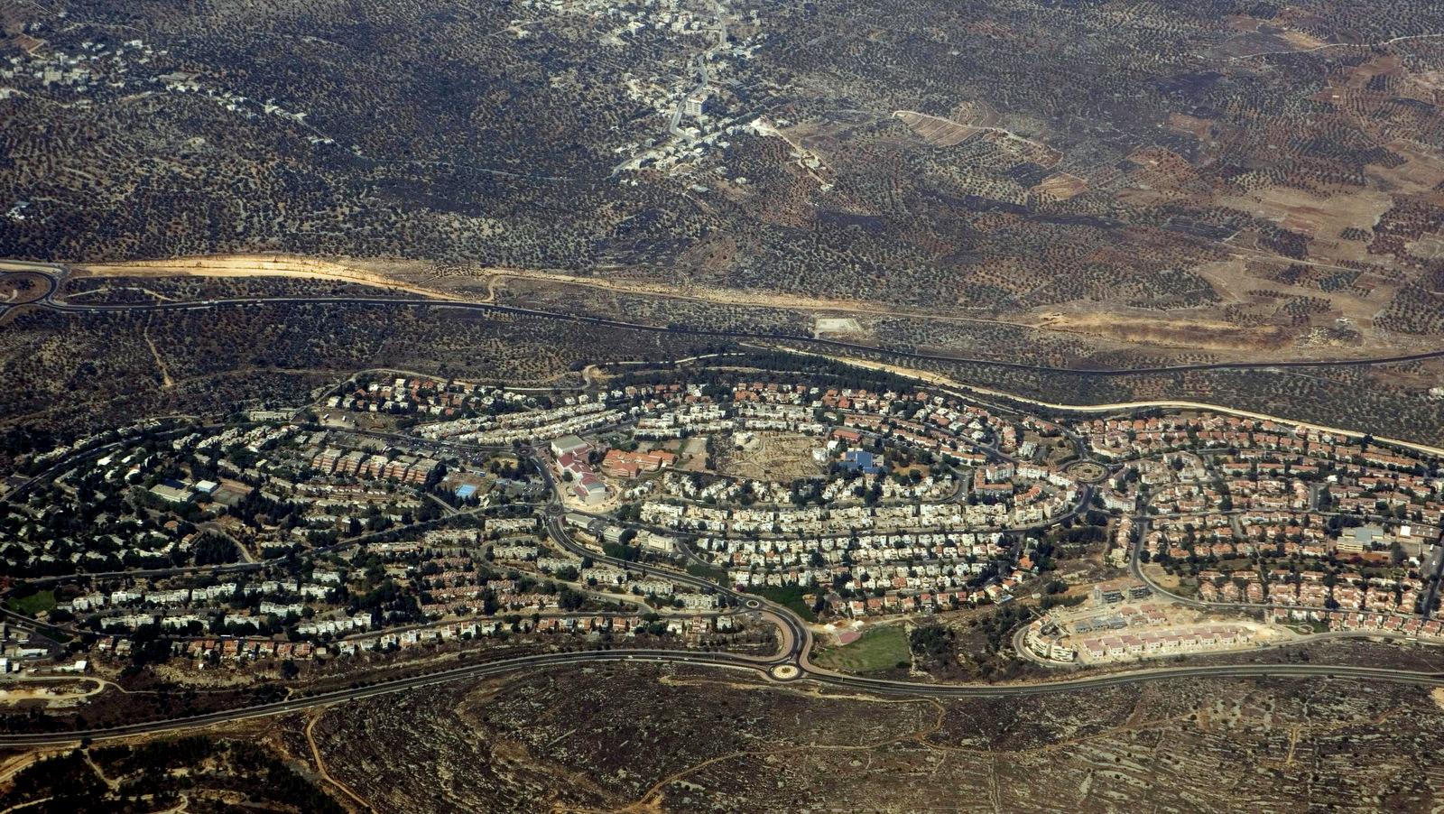 In this Sept. 20, 2010 aerial photo shows the walled West Bank Jewish settlement of Ariel is seen. Ariel Schalit | AP