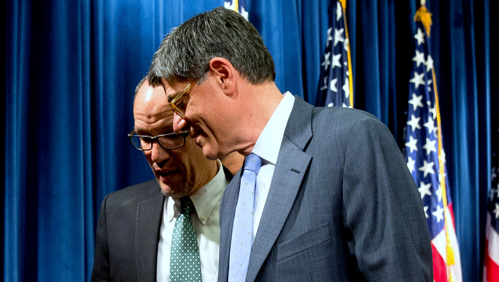 Former Treasury Secretary Jacob Lew, right, speaks to Thomas Perez at the Treasury Department in Washington, June 22, 2016, during the annual Social Security and Medicare Boards of Trustees report. (AP/Andrew Harnik)