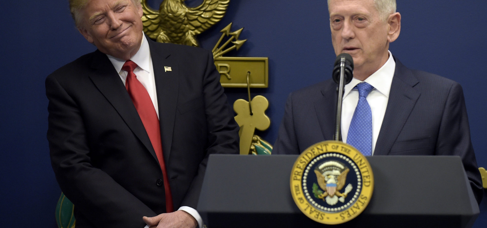 Donald Trump, left, listens as Defense Secretary James Mattis, right, speaks at the Pentagon in Washington. (AP/Susan Walsh)