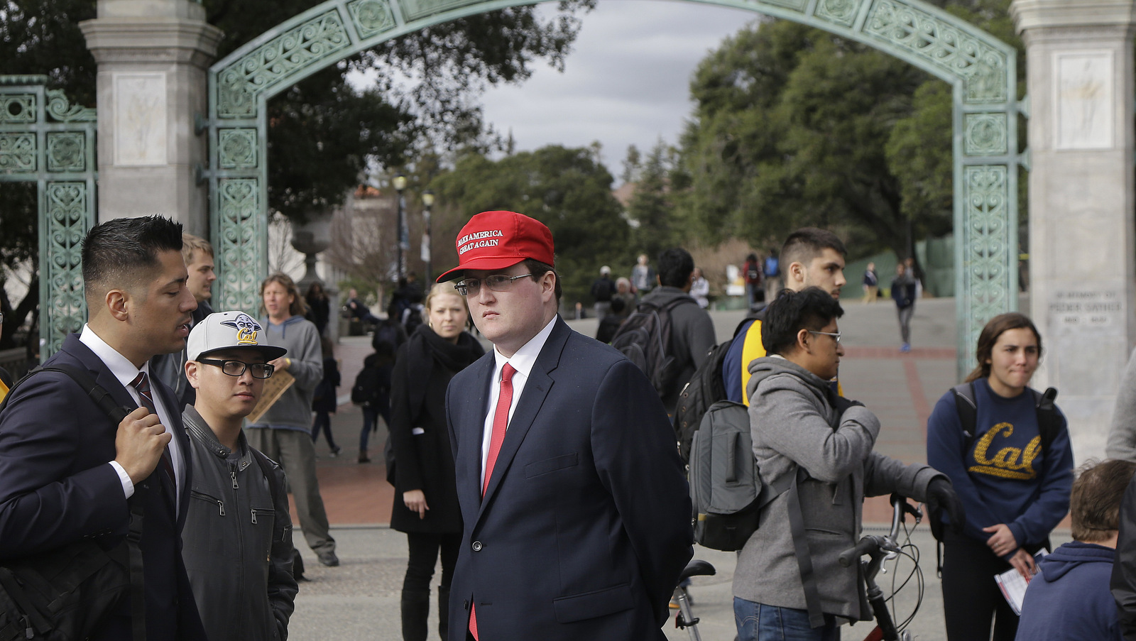 University of California, Berkeley, student Jack Palkovic, center, stands with others near a Berkeley College Republicans table in front of Sather Gate on campus in Berkeley, Calif., Thursday, Feb. 2, 2017. Palkovic claims  he was attacked on the campus a day after protests led authorities to cancel a controversial speech. (AP/Jeff Chiu)