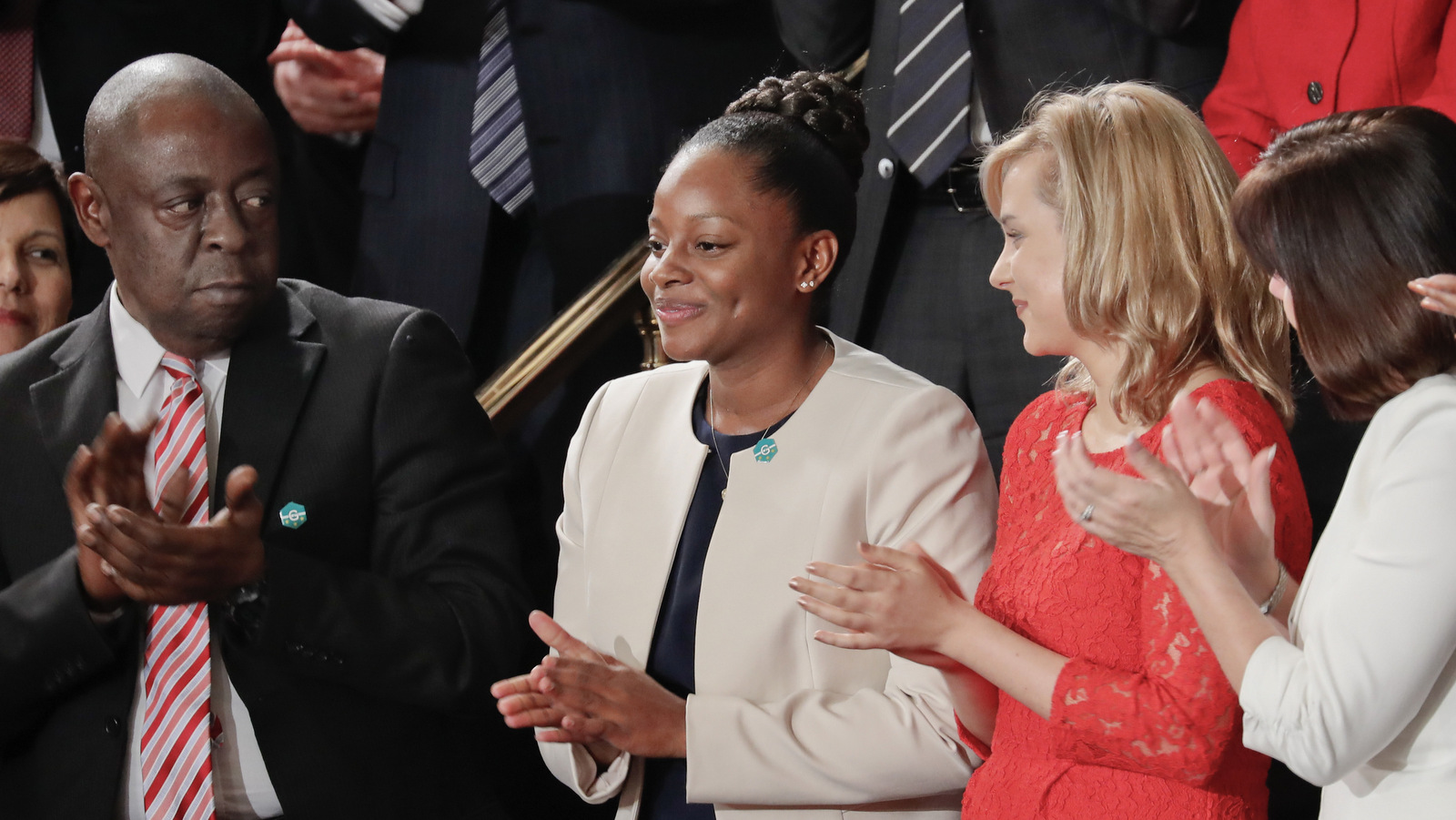 Denisha Merriweather, center, stands up after being acknowledge by President Donald Trump during his address Congress in Washington, Feb. 28, 2017. (AP/Pablo Martinez Monsivais)