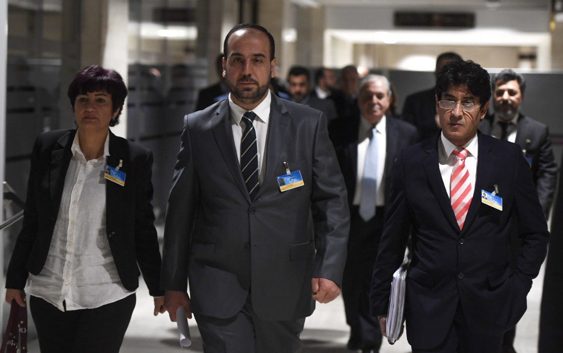 Syria's main opposition High Negotiations Committee (HNC) leader Nasr al-Hariri, center, arrives for a meeting of Intra Syria peace talks at the European headquarters of the United Nations in Geneva, on Thursday, March 2, 2017. (Philippe Desmazes/Keystone via AP, Pool)
