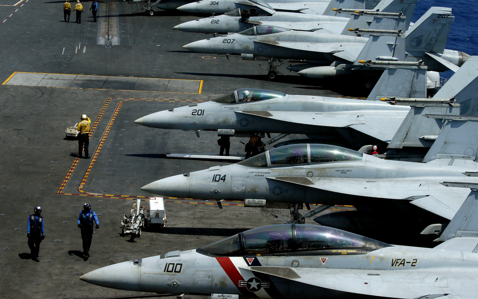 A row of F18 fighter jets on the deck of the U.S. Navy aircraft carrier USS Carl Vinson (CVN 70) is prepared for patrols off the disputed South China Sea Friday, March 3, 2017. The U.S. military took journalists Friday to the carrier on routine patrol off the disputed South China Sea, sending a signal to China and American allies of its resolve to ensure freedom of navigation and overflight in one of the world's security hotspots.(AP Photo/Bullit Marquez)