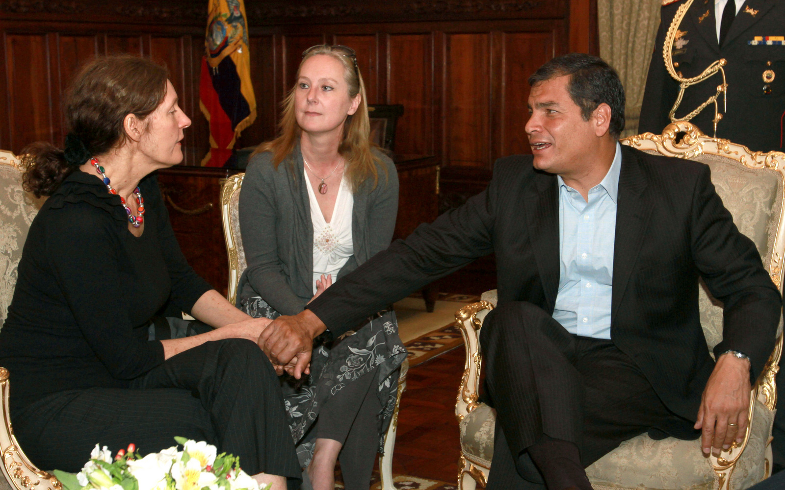 Ecuador's President Rafael Correa holds the hands of Christine Assange, the mother of WikiLeaks founder Julian Assange, during their meeting in Quito, Ecuador, Wednesday, Aug. 1, 2012. (AP/Martin Jaramillo)