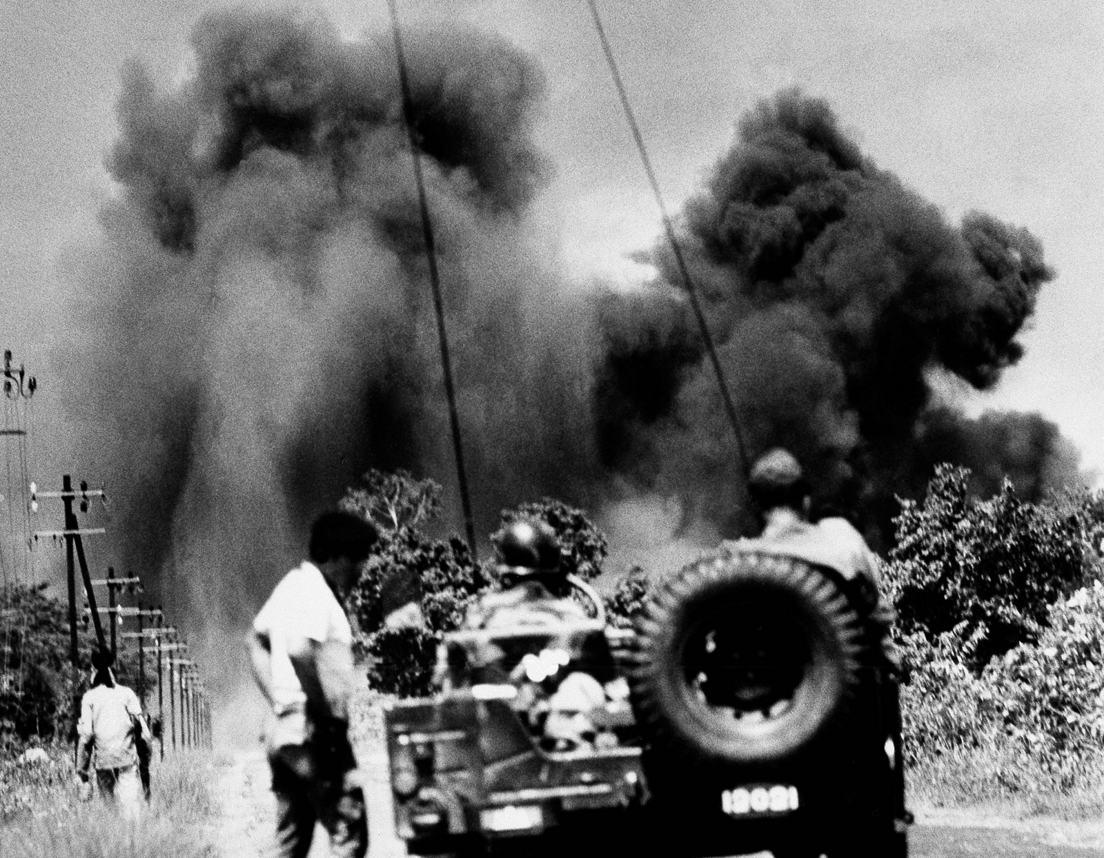 Smoke billows from air-strikes conducted by US Air Force F-100 fighter-bombers in Cambodia, 40 miles northeast of Phnom Penh on August 7, 1970.  (AP/Ghislain Bellorget)