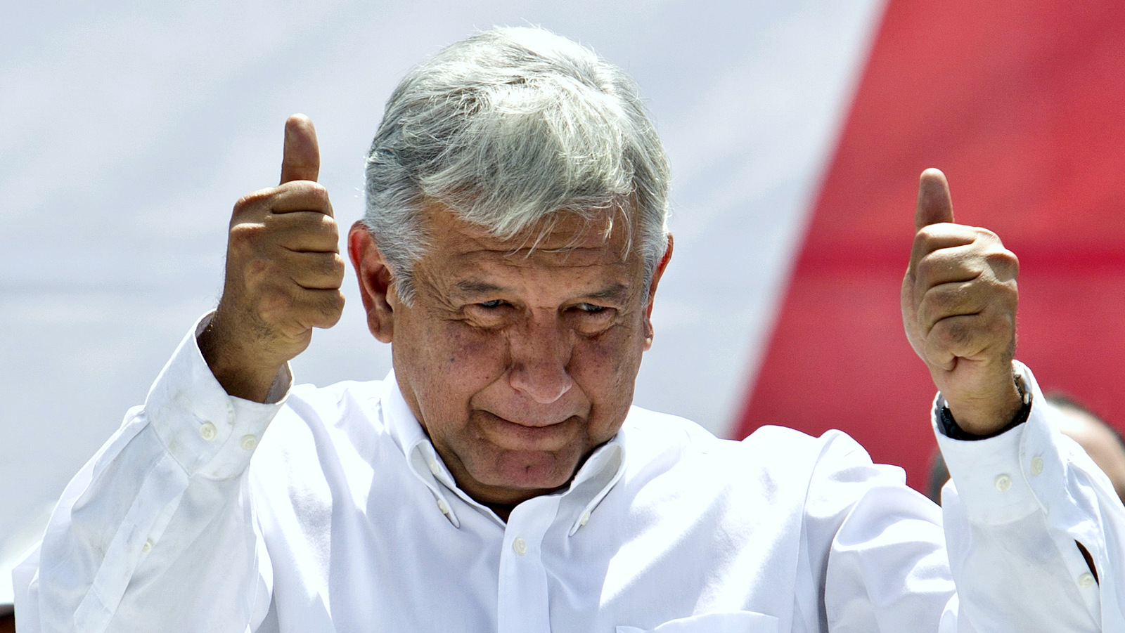 Andres Manuel Lopez Obrador, Mexican presidential candidate , gives a thumbs up to his supporters at Mexico City's main plaza, the Zocalo, Sunday, Sept. 9, 2012. (AP/Christian Palma)