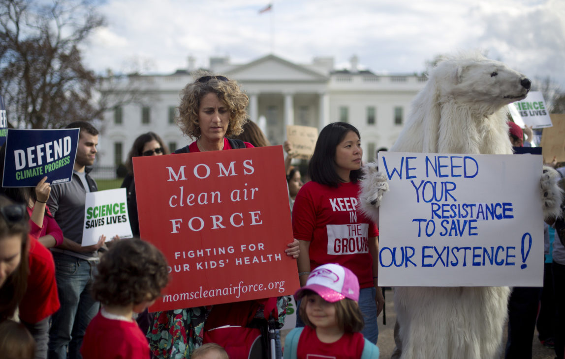 In this Tuesday, March 28, 2017 file photo, demonstrators gather in front of the White House in Washington, during a rally against President Donald Trump's Energy Independence Executive order. (AP/Pablo Martinez Monsivais)