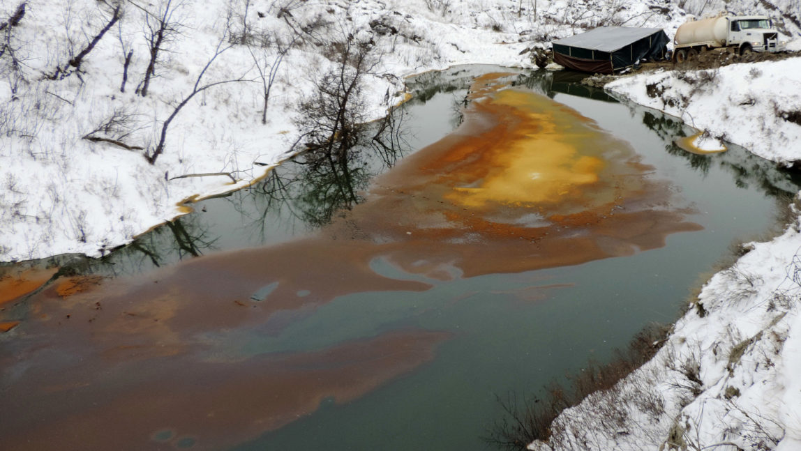 Aan oil spill from the Belle Fourche Pipeline that was discovered Dec. 5, 2016 in Ash Coulee Creek, a tributary of the Little Missouri River, near Belfield, N.D. Authorities say the pipeline spill is now believed to be one of the biggest in state history. (Scott Stockdill/North Dakota Department of Health via AP)