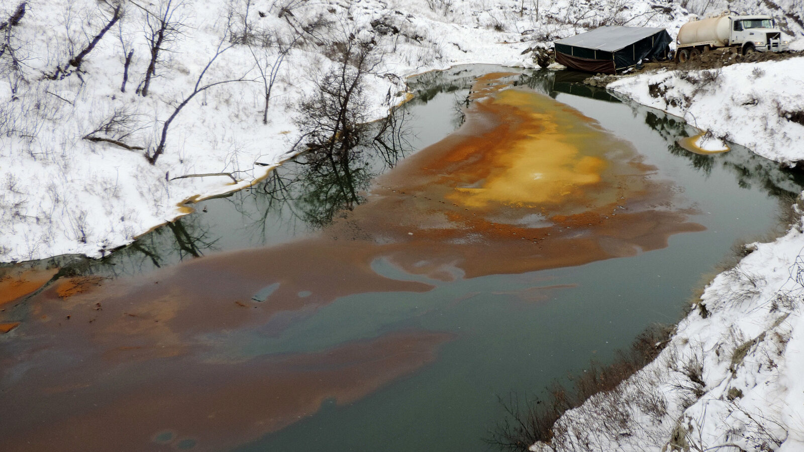 Aan oil spill from the Belle Fourche Pipeline that was discovered Dec. 5, 2016 in Ash Coulee Creek, a tributary of the Little Missouri River, near Belfield, N.D. Authorities say the pipeline spill is now believed to be one of the biggest in state history. (Scott Stockdill/North Dakota Department of Health via AP)