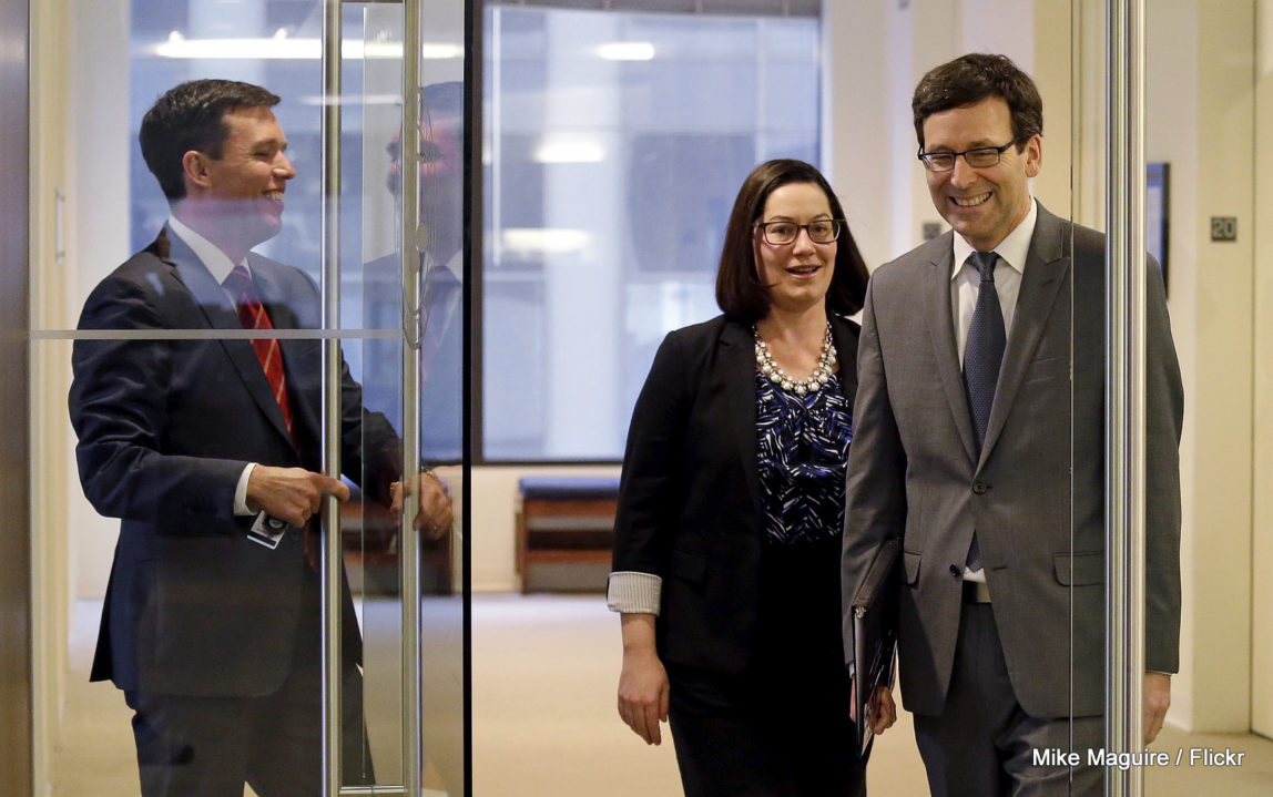 Washington State Attorney General Bob Ferguson, right, arrives for a news conference about the state's response to President Trump's revised travel ban with Solicitor General Noah Purcell, left, and Civil Rights Unit Chief Colleen Melody, Thursday, March 9, 2017, in Seattle. (AP/Elaine Thompson)