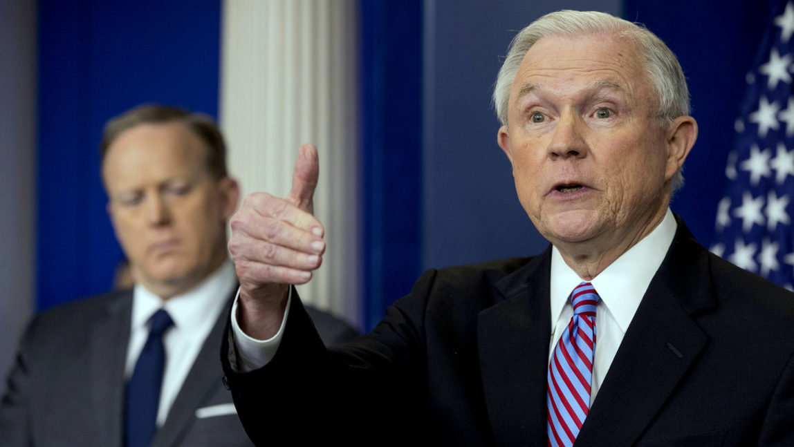 Attorney General Jeff Sessions, right, accompanied by White House press secretary Sean Spicer, talks to the media during the daily press briefing at the White House in Washington, March 27, 2017. (AP/Andrew Harnik)