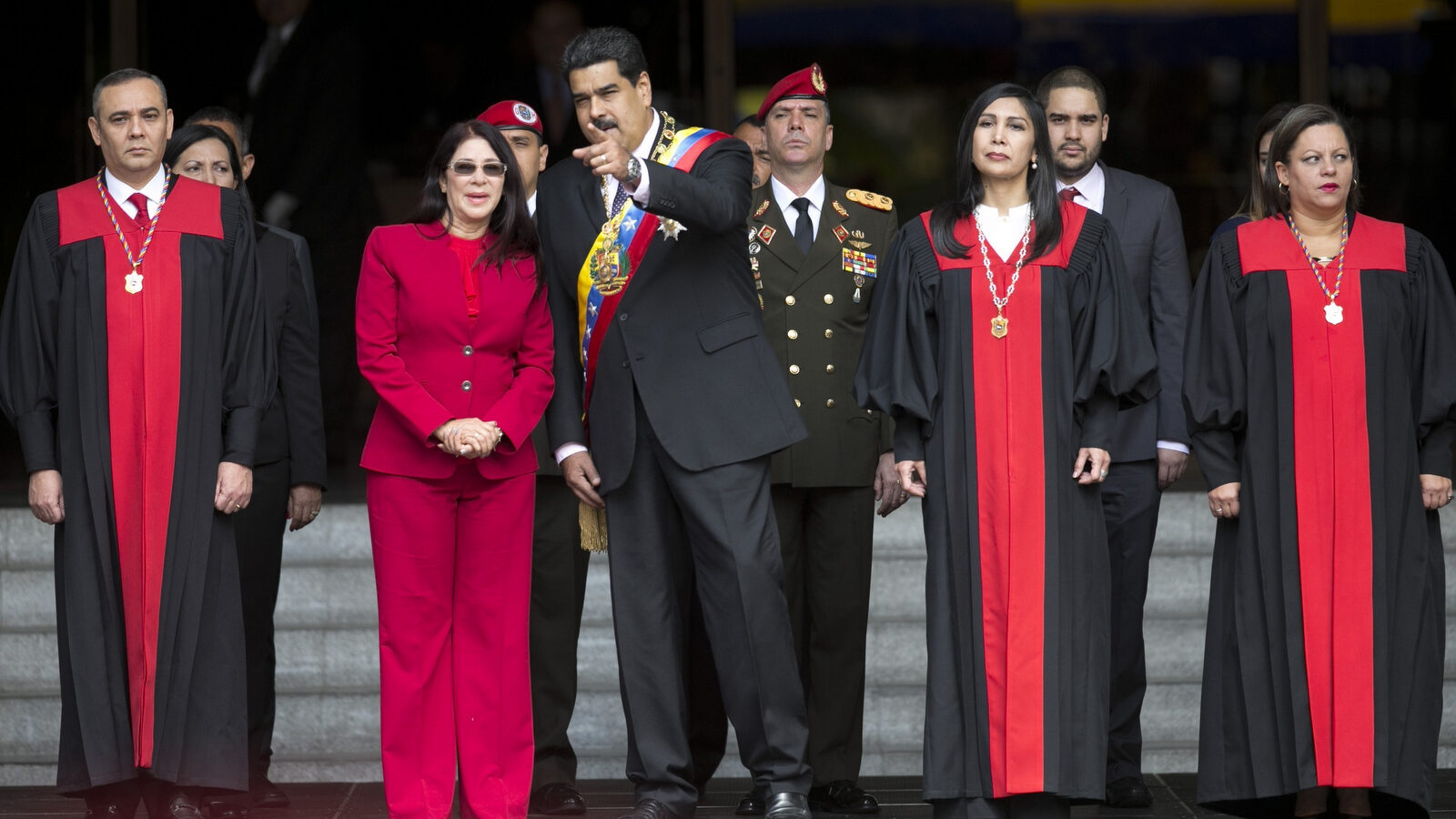 Venezuela's President Nicolas Maduro speaks with first lady Cilia Flores as they arrive to the Supreme Court, before delivering his state of the union address, in Caracas, Venezuela. (AP/Ariana Cubillos)