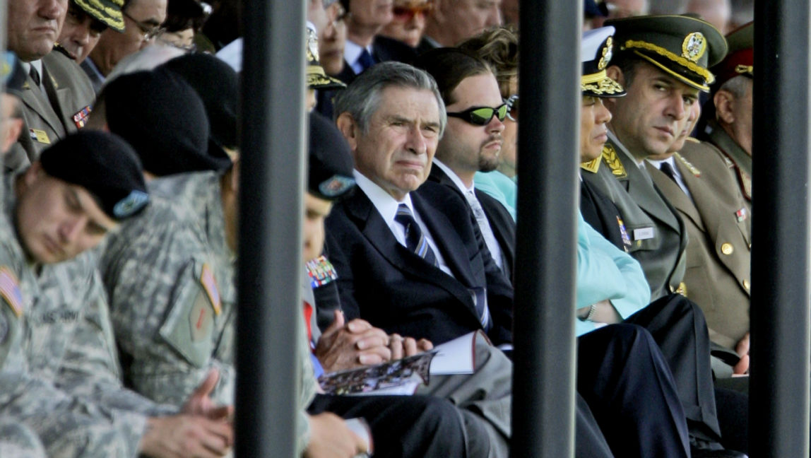 Former Deputy Defense Secretary, and former World Bank President Paul Wolfowitz, center, attends a farewell ceremony for outgoing Joint Chiefs Chairman Gen. Peter Pace. (AP/Pablo Martinez Monsivais)