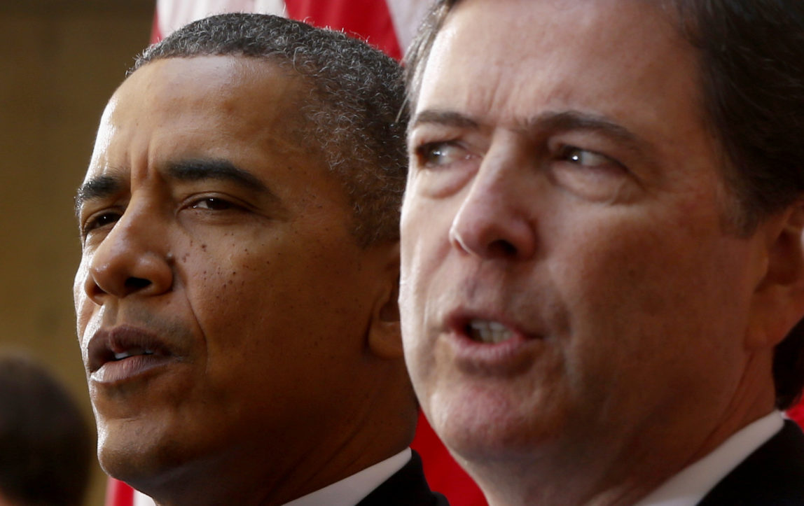 In this Oct. 28, 2013 photo, President Barack Obama and FBI Director James Comey participate in the installation ceremony for Comey as FBI director, at FBI Headquarters in Washington. (AP/Charles Dharapak)