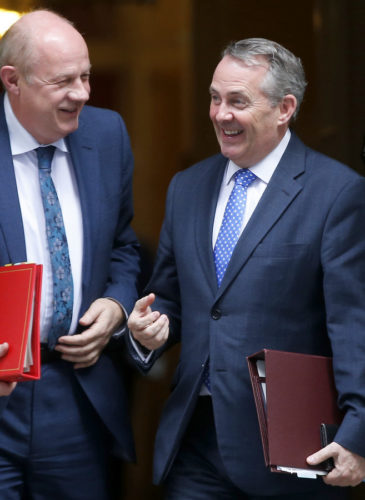 Liam Fox, right, British Secretary of State for International Trade, and Damien Green, the Work and Pensions Secretary smile as they leave 10 Downing Street following the weekly cabinet meeting in London, Tuesday, March 21, 2017. (AP/Alastair Grant)