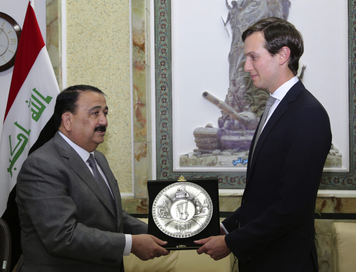Jared Kushner, right, U.S. President Donald Trump's son-in-law and senior adviser, receives a gift from Iraqi Defense Minister, Ifran al-Hayali, at the Ministry of Defense, Baghdad, Iraq., April 3, 2017. (AP Photo)