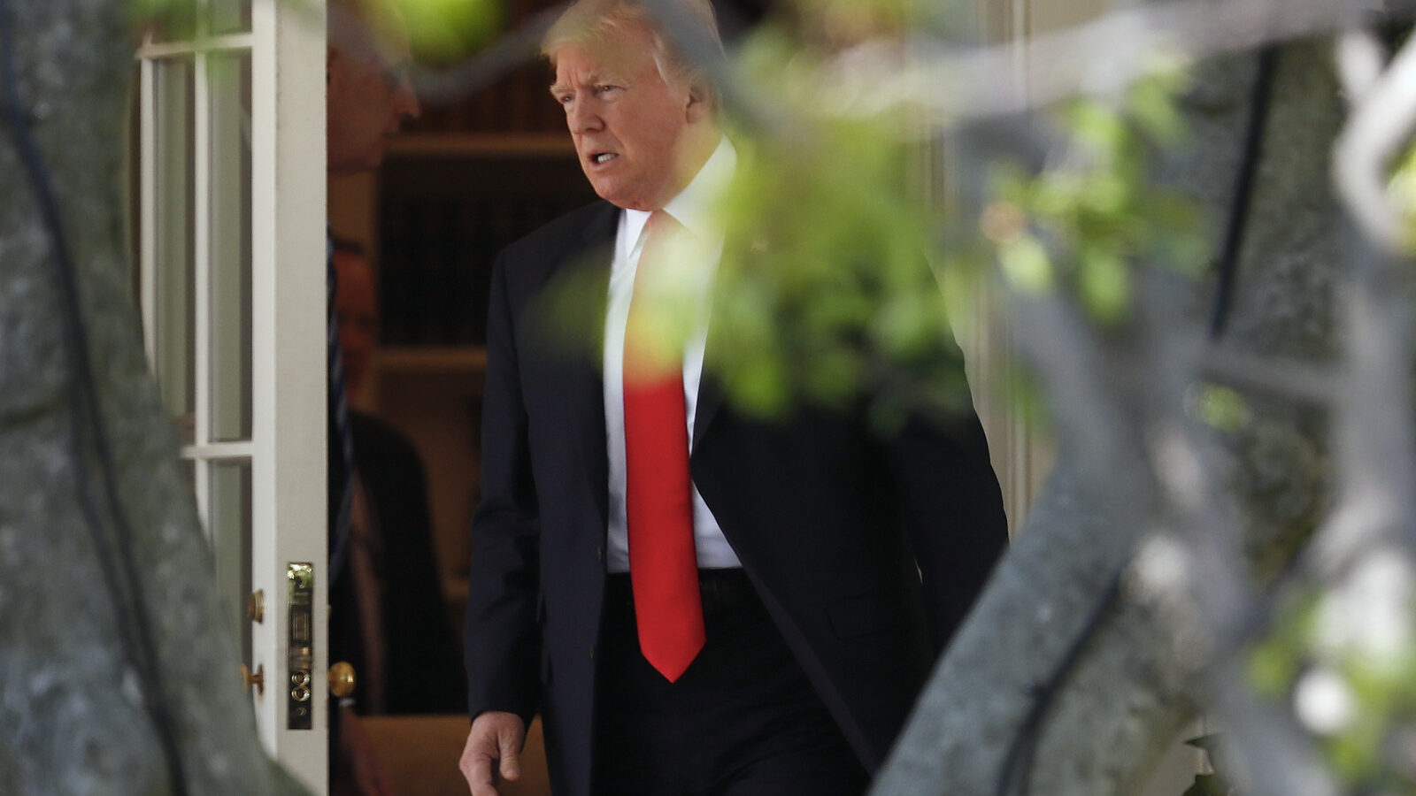 President Donald Trump walks out of the Oval Office of the White House in Washington, Tuesday, April 18, 2017. (AP/Carolyn Kaster)