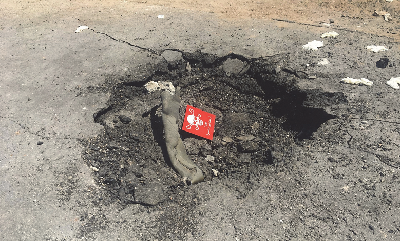 Close up photograph of the crater that has been shown in numerous mainstream media publications that the White House alleges is proof that the source of the nerve agent attack was the Syrian government.