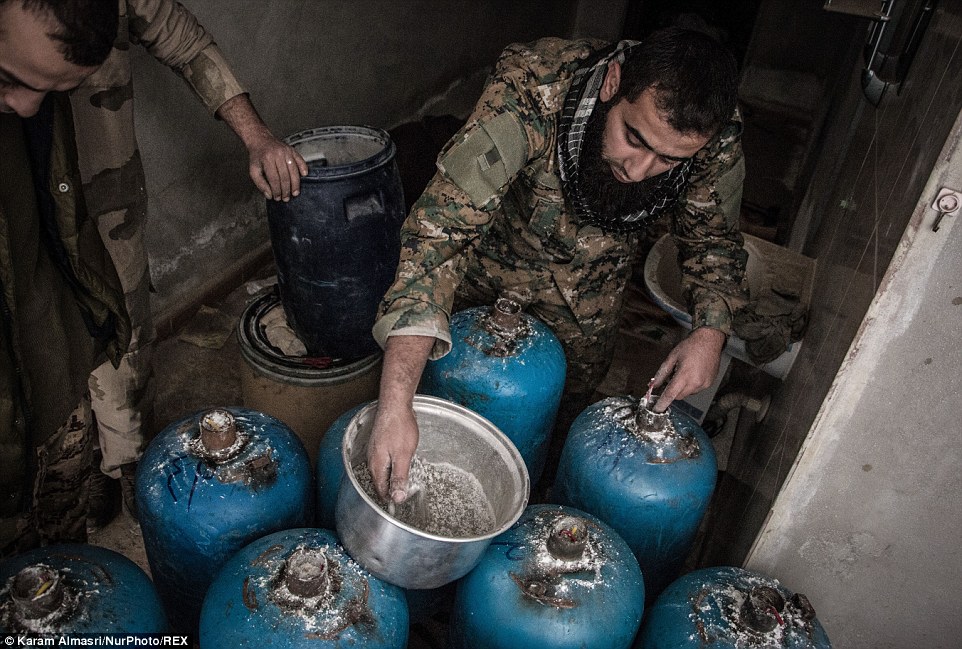 Syrian rebels prepare highly modified propane gas cylinders for use as ammunition in homemade 'hell cannons'.
