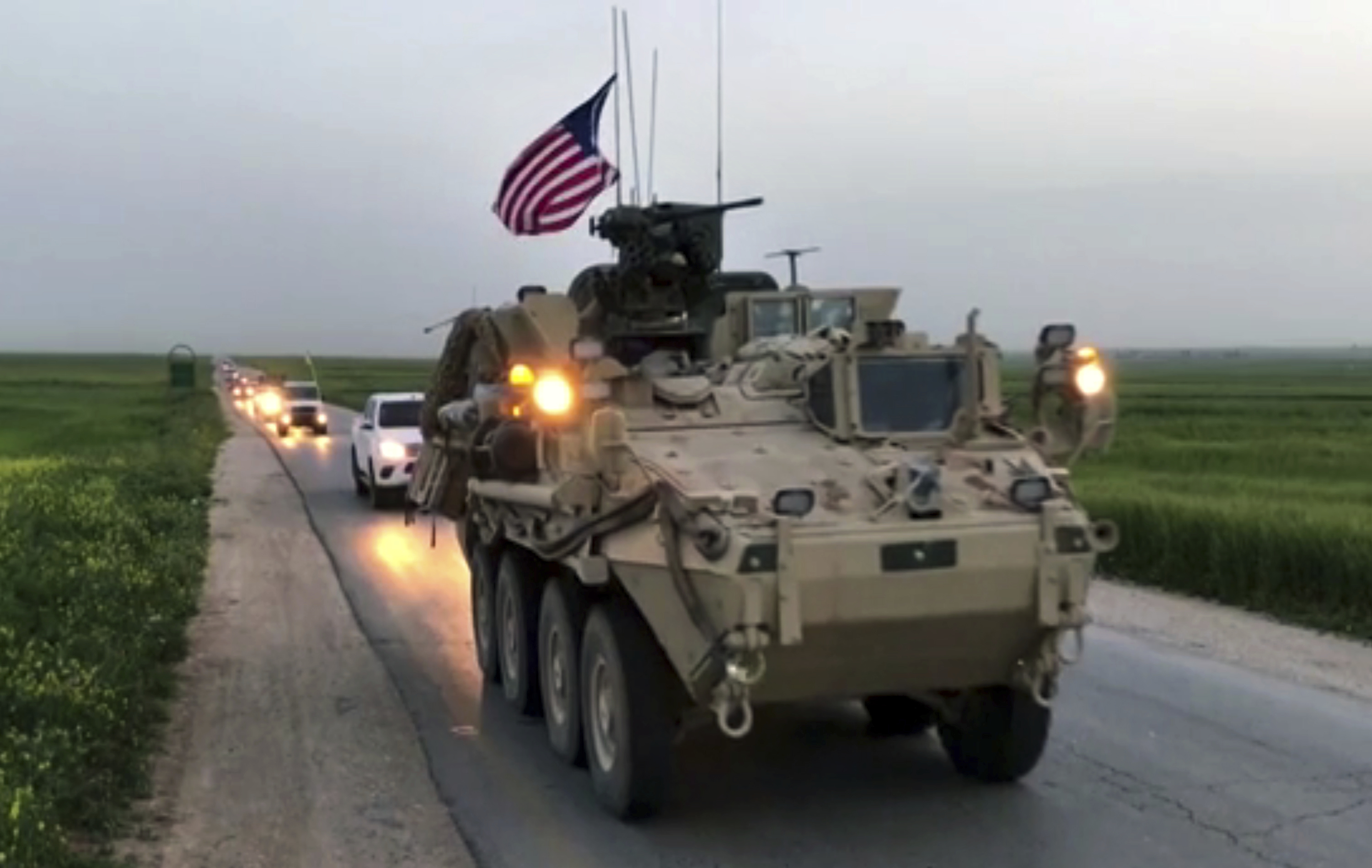 This Friday, April 28, 2017 still taken from video, shows U.S. forces patrolling on a rural road in the village of Darbasiyah, in northern Syria. (AP via APTV)