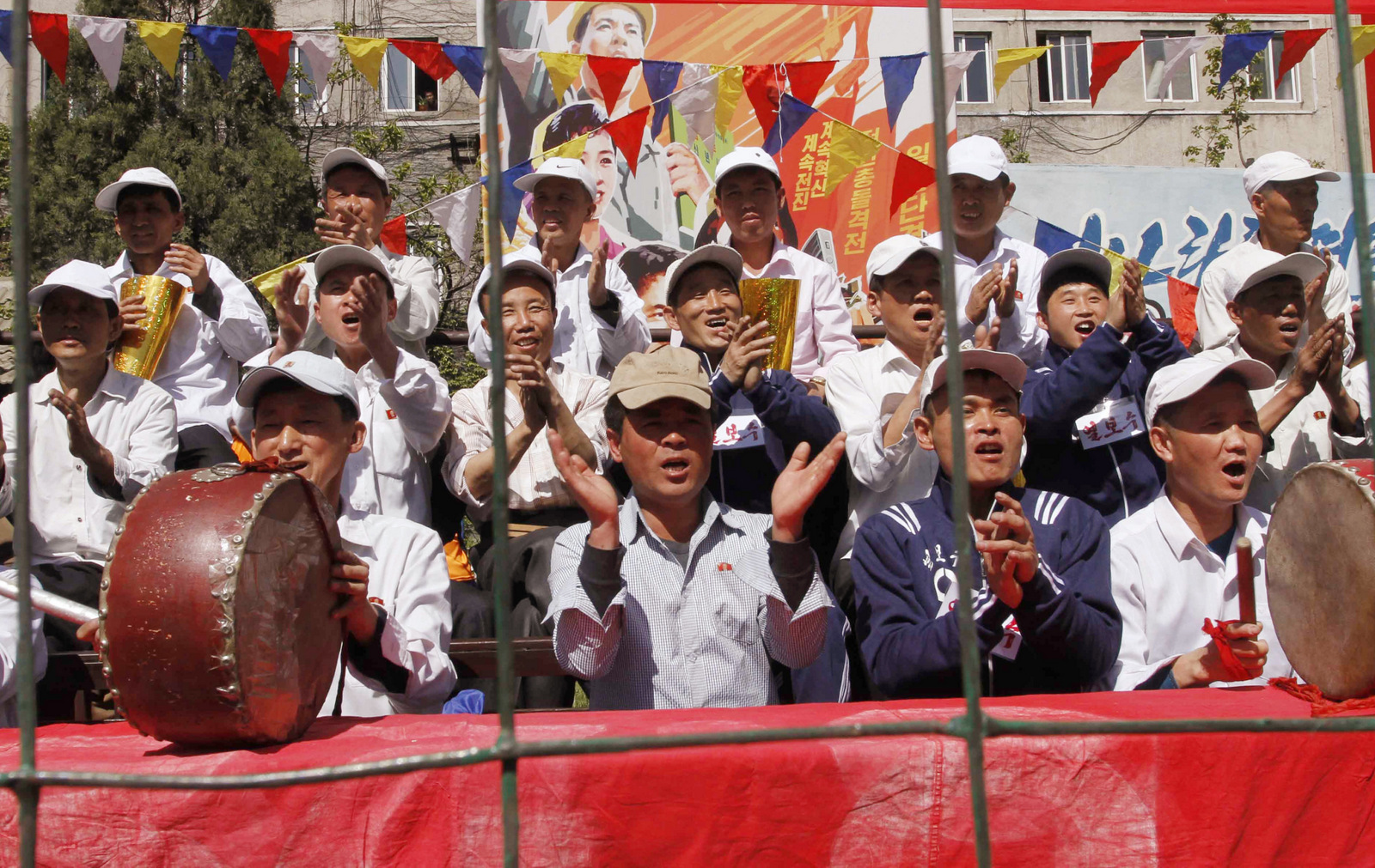 North Korean workers cheer as they celebrate May Day at the Pyongyang Thermal Power Complex in Pyongyang, North Korea, Monday, May 1, 2017. International Workers' Day, which is also known as Labor Day in some countries, is being celebrated worldwide. 