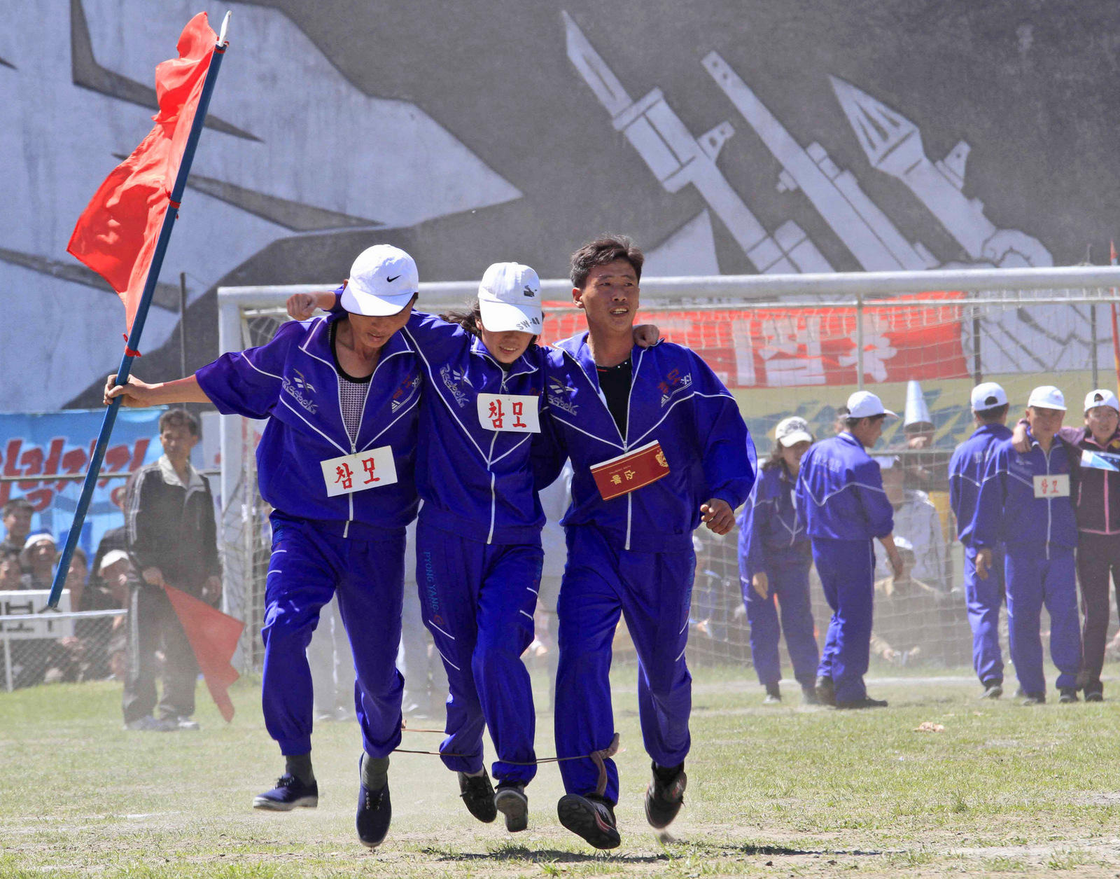 North Korean workers, with their legs tied together, take part in a competition as they celebrate May Day at the Pyongyang Thermal Power Complex in Pyongyang, North Korea, Monday, May 1, 2017. International Workers' Day, which is also known as Labor Day in some countries, is being celebrated worldwide. 