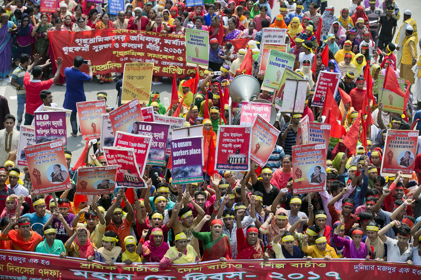 Bangladeshi workers and activists shout slogans as they participate in a May Day rally in Dhaka, Bangladesh, Monday, May 1, 2017. Thousands of workers and activists marched during International Workers' Day demanding higher wages and better work conditions. 