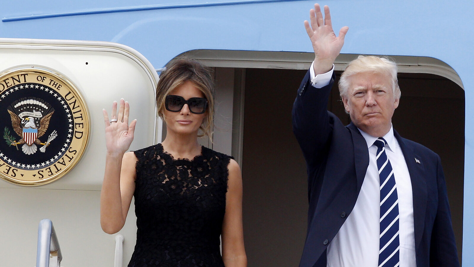 Donald and Melania Trump wave to reporters before boarding the Air Force One to Brussels, at the end of a 2-day visit to Italy, May 24, 2017. (AP/Riccardo De Luca)
