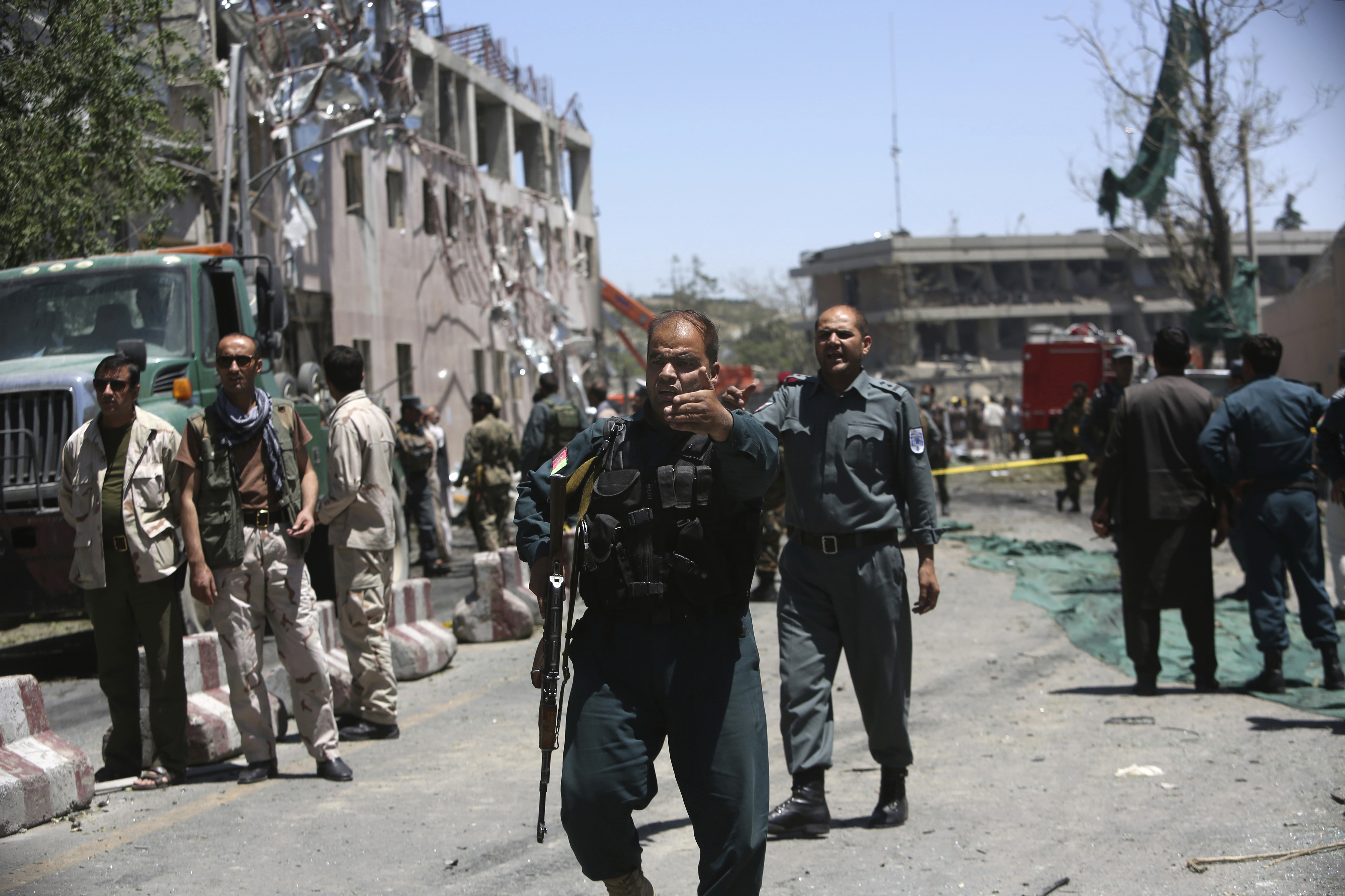 Security forces inspect near the site of a suicide attack in Kabul, Afghanistan, May 31, 2017. A massive explosion rocked a highly secure diplomatic area of Kabul on Wednesday morning, causing casualties and sending a huge plume of smoke over the Afghan capital. (AP/Rahmat Gul)