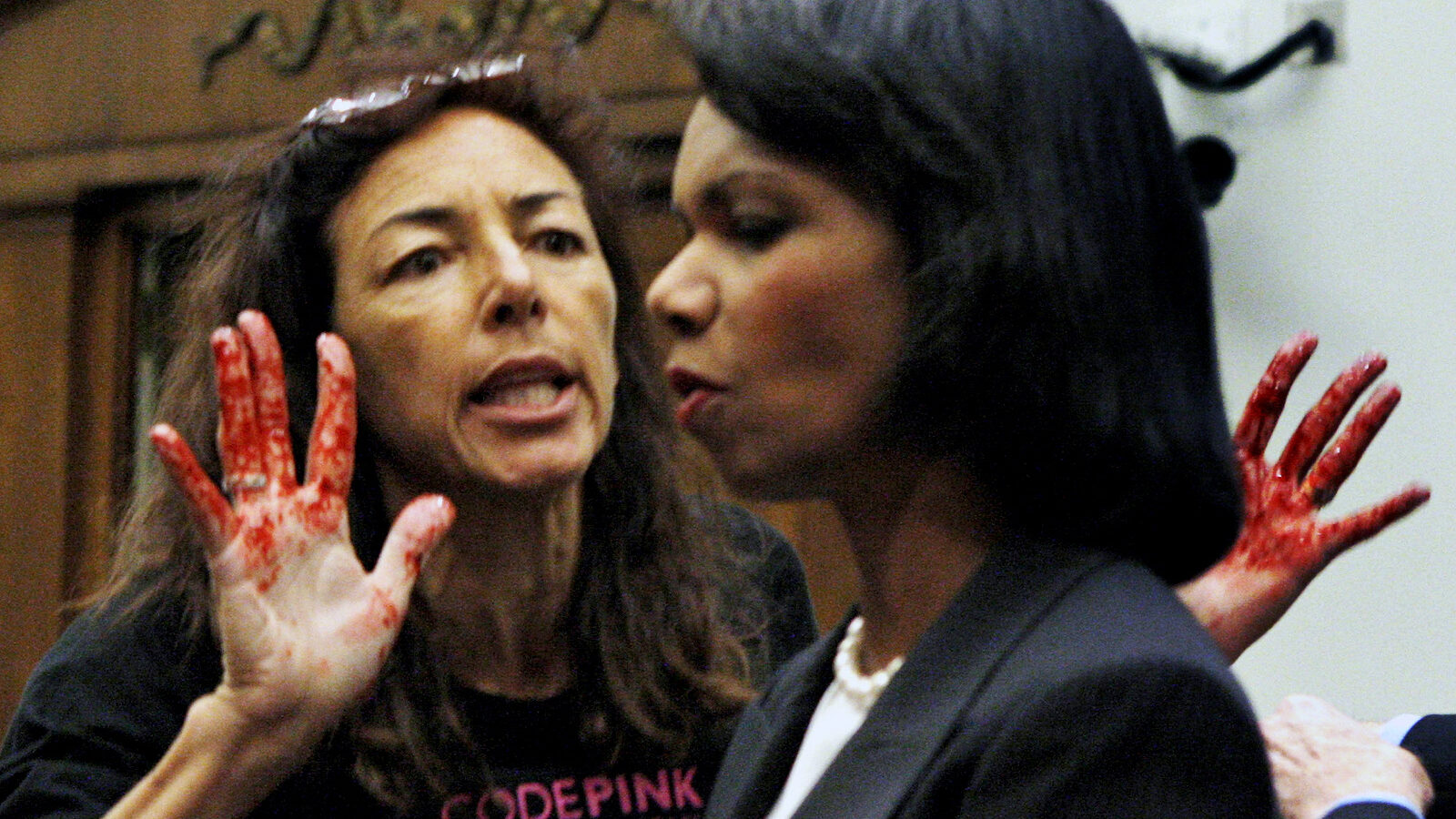 Code Pink member Desiree Anita Ali-Fairooz, pictured here confronting Secretary of State Condoleezza Rice over the Iraq war, has been convicted of being disruptive at US Attorney General Jeff Sessions' confirmation hearing. (AP/Charles Dharapak)