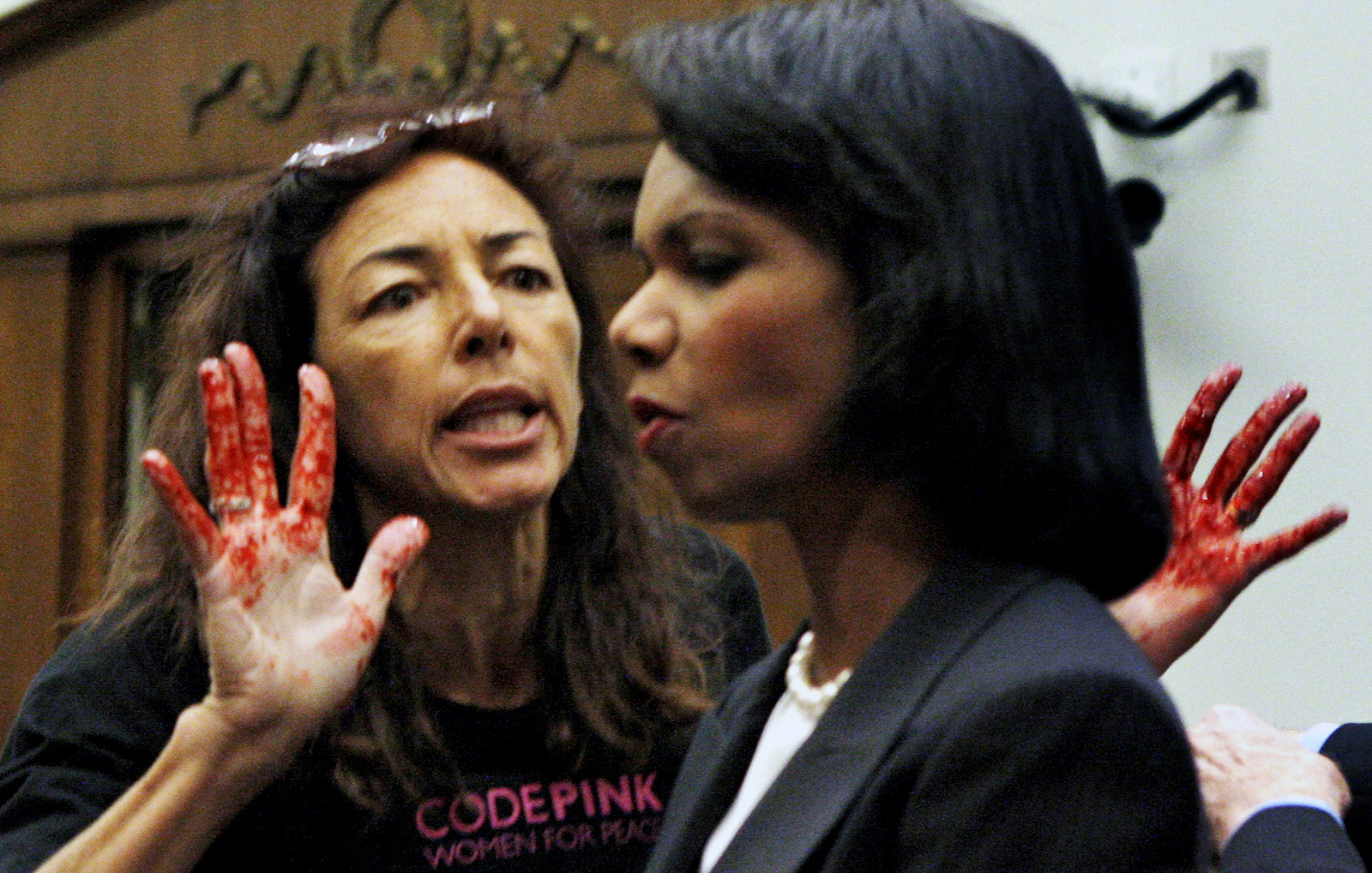 Code Pink member Desiree Anita Ali-Fairooz, pictured here confronting Secretary of State Condoleezza Rice over the Iraq war, has been convicted of being disruptive at US Attorney General Jeff Sessions' confirmation hearing. (AP/Charles Dharapak)
