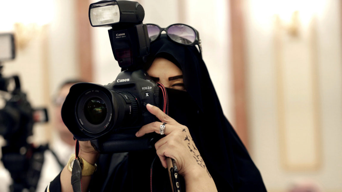 A journalist takes photos at a palace in Riyadh, Saudi Arabia. (AP/Hasan Jamali)