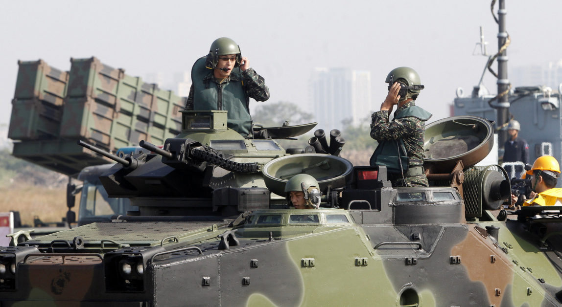 Soldiers on a AAV7 Amphibious Assault Vehicle communicate during military exercises at the Zuoying naval base in Kaohsiung, southern of Taiwan, Wednesday, January 18, 2017. (AP/Chiang Ying-ying)