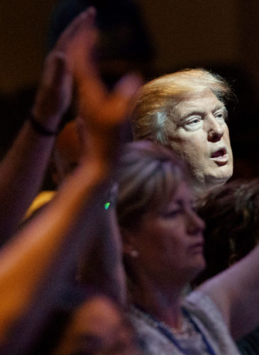 Donald Trump stands during a service at the International Church of Las Vegas in Las Vegas. President Trump’s move to scrap limits on church political activity could have sweeping effects that extend beyond his conservative supporters. (AP/Evan Vucci)