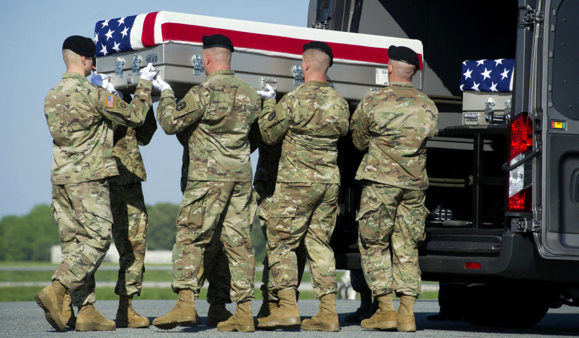 An Army carry team places the transfer case containing the remains of Army Sgt. Joshua Rodgers, 22, of Bloomington, Ill., who was killed during a raid on an alleged ISIS compound in eastern Afghanistan. (AP/Cliff Owen)