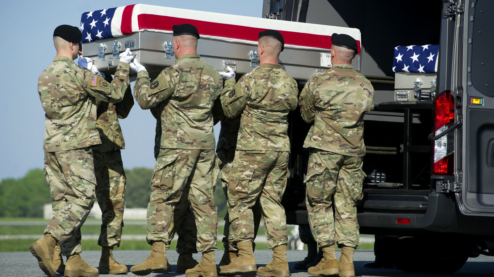 An Army carry team places the transfer case containing the remains of Army Sgt. Joshua Rodgers, 22, of Bloomington, Ill., who was killed during a raid on an alleged ISIS compound in eastern Afghanistan. (AP/Cliff Owen)