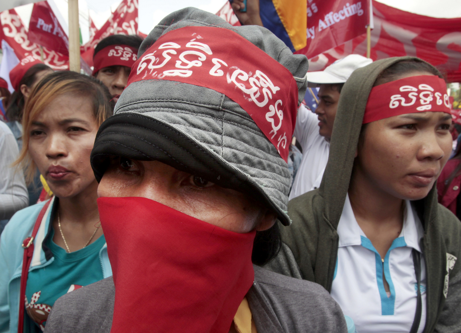 Cambodian garment workers wear headbands reading "Our rights" during a gathering to mark May Day at a blocked street near National Assembly in Phnom Penh, Cambodia, Monday, May 1, 2017. More than 1,000 workers staged a rally under a topic of "Living Wage Rights" and demanded a better working condition. 