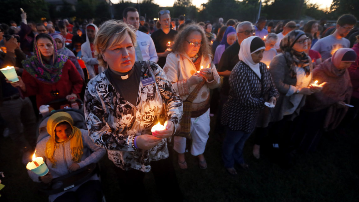 A few hundred supporters stand holding lit candles as they listen to comments from speakers during a vigil for Jordan Edwards in Balch Springs, Texas, Thursday, May 4, 2017. (AP/Tony Gutierrez)