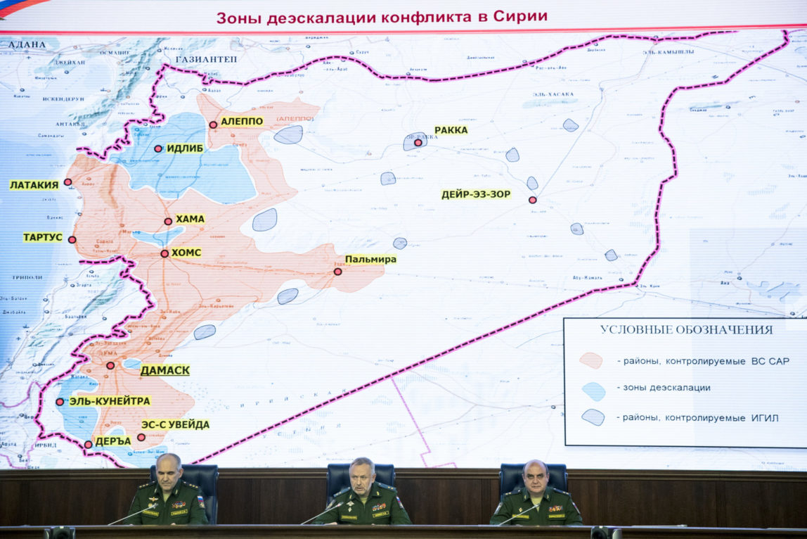 Russian generals attend a briefing in the Defense Ministry in Moscow, Russia, Friday, May 5, 2017. Russia's military says the agreement setting up four de-escalation zones in Syria will go into effect at midnight. The military also says the deal, which was signed by Russia, Iran and Turkey in Kazakhstan the day before, could be extended to more areas of the war-torn country. The sign on top of the map reads Syrian safe zones. (AP/Pavel Golovkin)