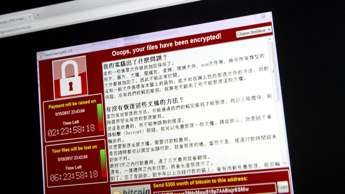 A screenshot of the warning screen from a purported ransomware attack, as captured by a computer user in Taiwan, is seen on laptop in Beijing, Saturday, May 13, 201. (AP/Mark Schiefelbein)