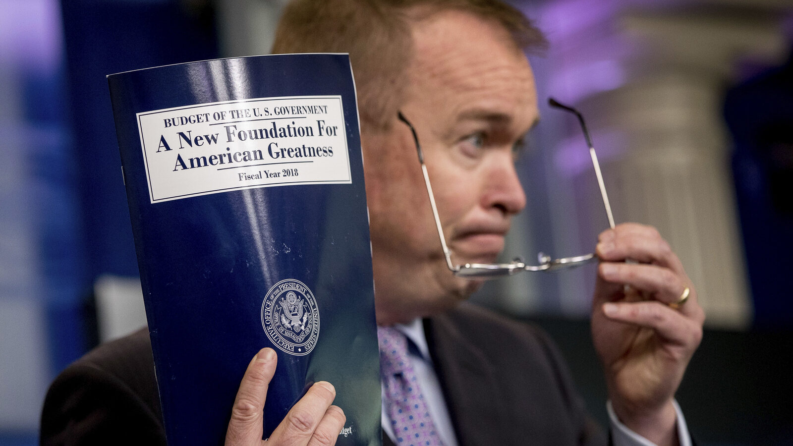Budget Director Mick Mulvaney holds up a copy of President Donald Trump's proposed fiscal 2018 federal budget. (AP/Andrew Harnik)