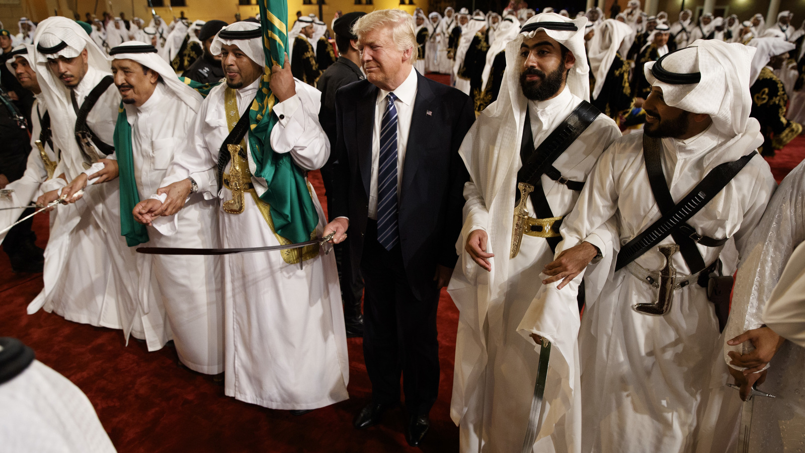 Donald Trump holds a sword and sways with traditional dancers during a welcome ceremony at Murabba Palace, in Riyadh, May 20, 2017. (AP/Evan Vucci)