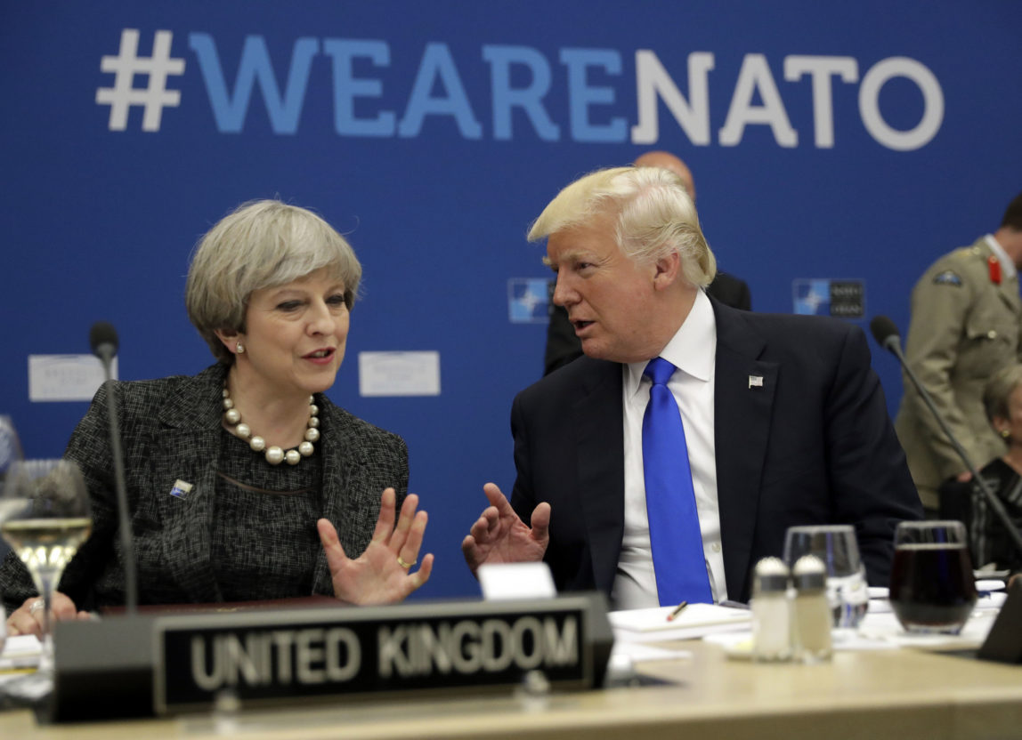 Donald Trump, right, speaks to British Prime Minister Theresa May during a meeting at the NATO headquarters in Brussels, May 25, 2017. (AP/Matt Dunham)