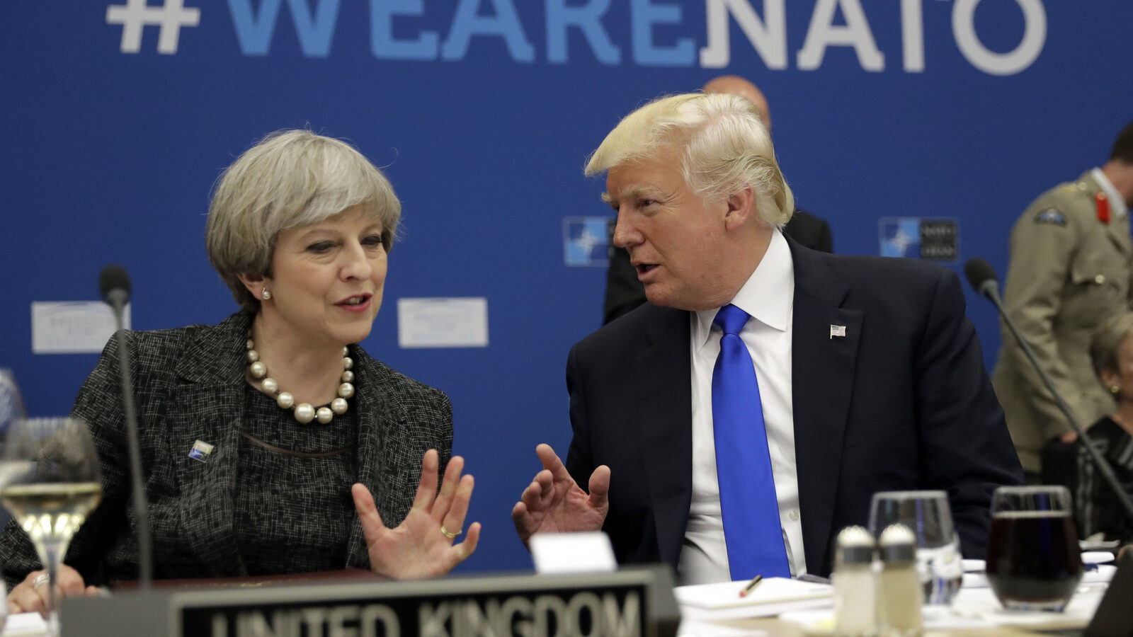 Donald Trump, right, speaks to British Prime Minister Theresa May during a meeting at the NATO headquarters in Brussels, May 25, 2017. (AP/Matt Dunham)