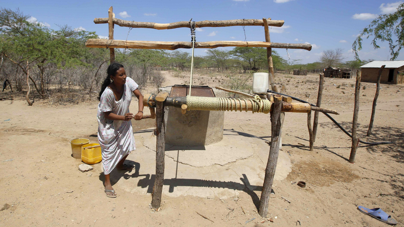 Wayuu indigenous woman Rosalba Castro, 20, draws water from a community well in Manaure, Colombia, Thursday, Sept. 10, 2015. (AP/Fernando Vergara)