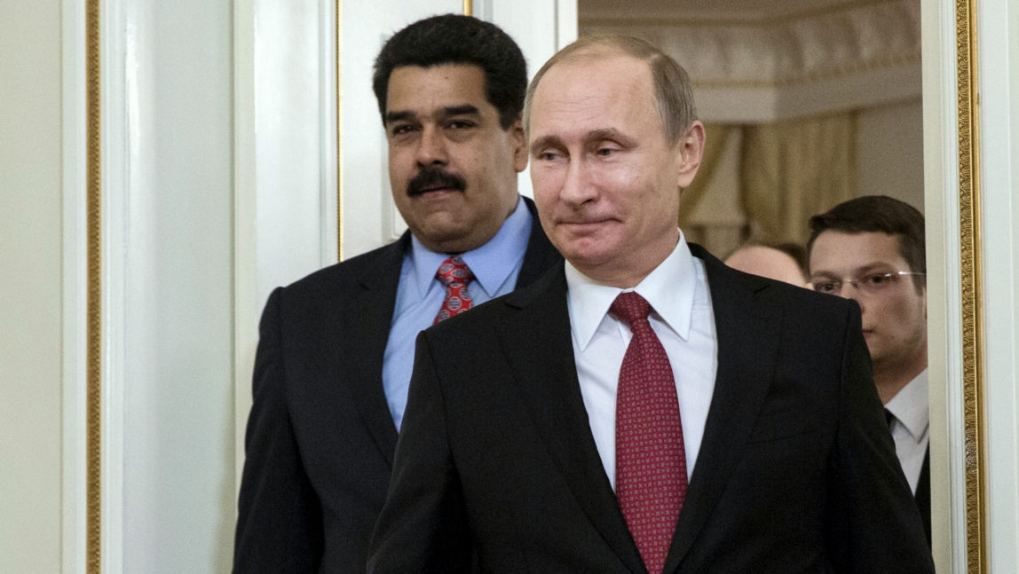 Russian President Vladimir Putin, front, and Venezuelan President Nicolas Maduro enter the hall during their meeting in the Novo-Ogaryovo residence outside Moscow, Russia, Jan. 15, 2015. (AP/Pavel Golovkin)