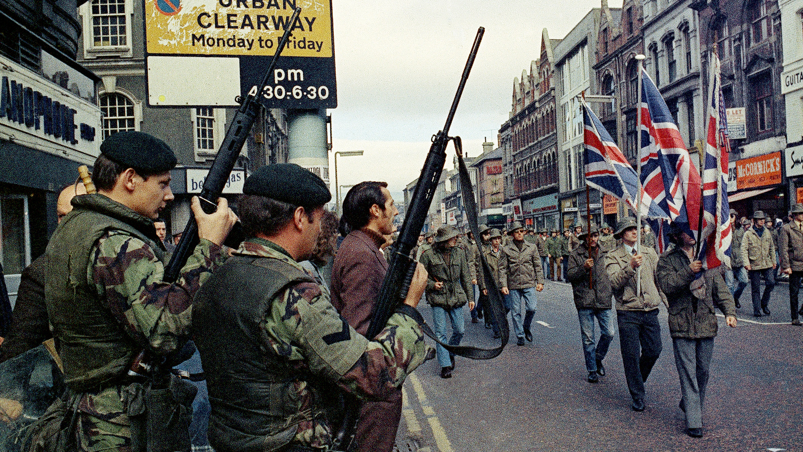 The Pro-British Ulster Defence Association parade through Belfast, Northern Ireland under the protection of armed British troops, in August 1972. (AP Photo)