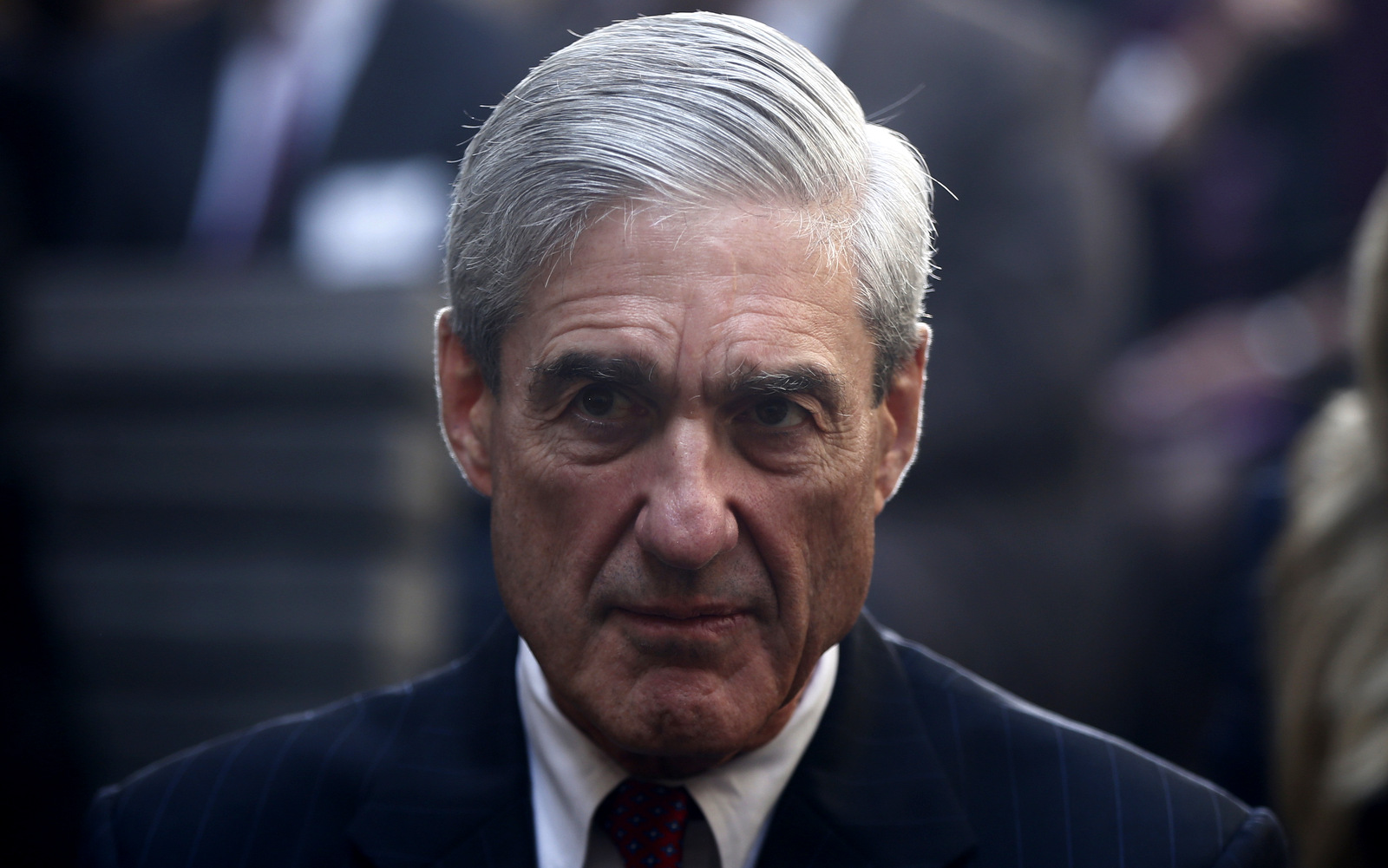 Former FBI Director Robert Mueller is seated before President Barack Obama and FBI Director James Comey arrive at an installation ceremony at FBI Headquarters in Washington, Oct. 28, 2013.(AP/Charles Dharapak)