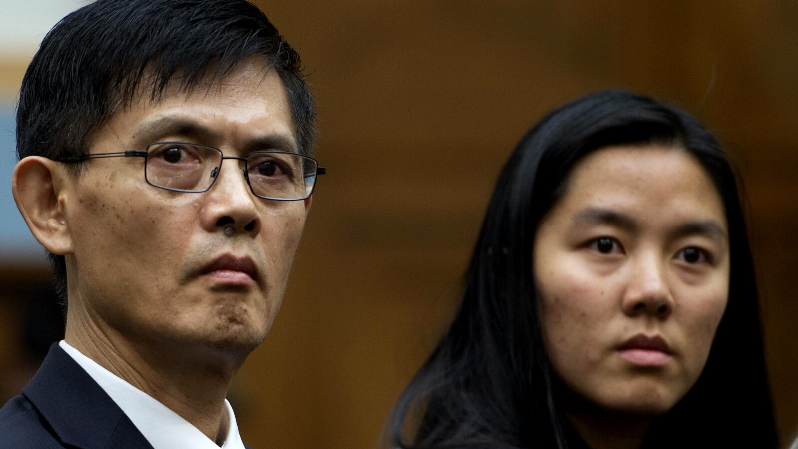 Xiaoxing Xi sits in a federal courthouse where he pleaded not guilty in tech case. Prosecutors have since droped all charges.