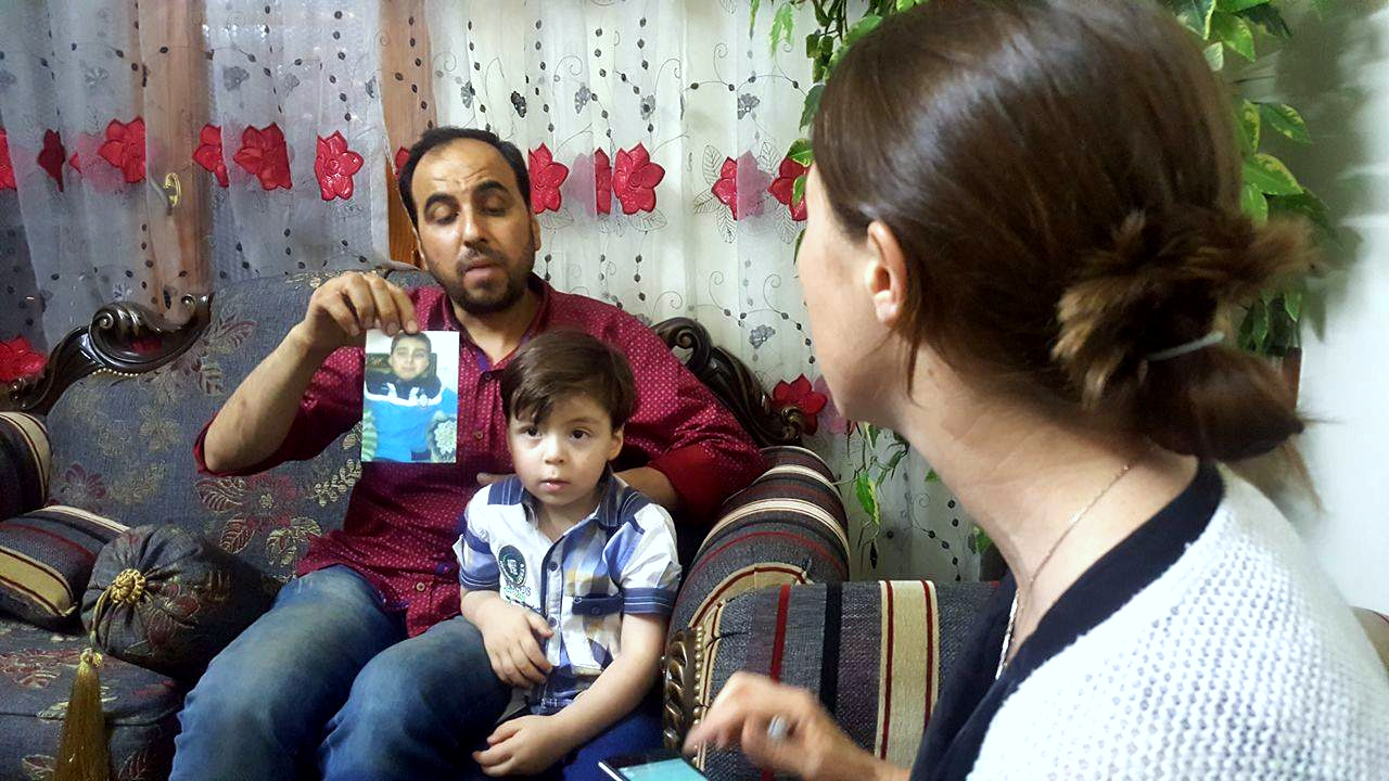 Mohammed Daqneesh displays a photo of his 11 year old son who died due to injuries sustained the same day that Omran, known as the Aleppo boy) was mildly wounded, a fact the much of the media missed. Aleppo, Syria, June 6, 2017 (Photo: Danny Makki/MintPress News)